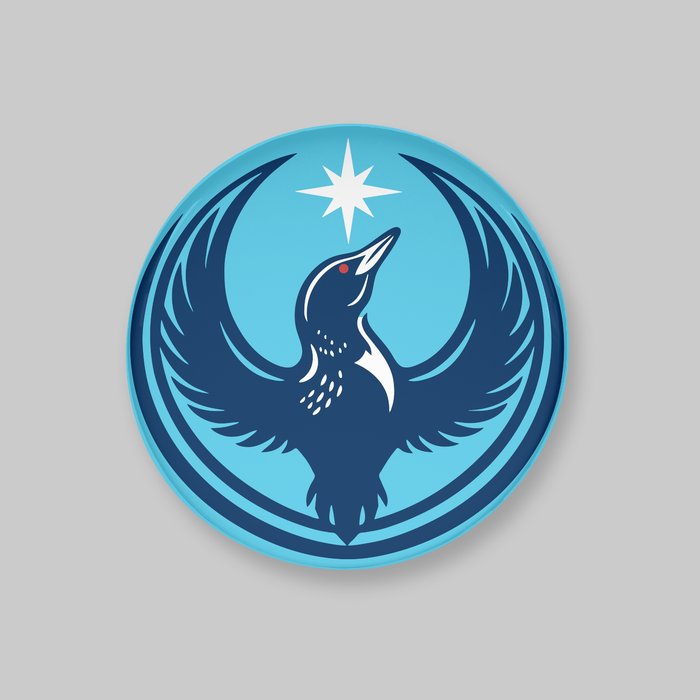 Circular logo with a stylized loon and star design on a gray background